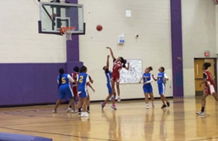  A basketball player shooting a floater